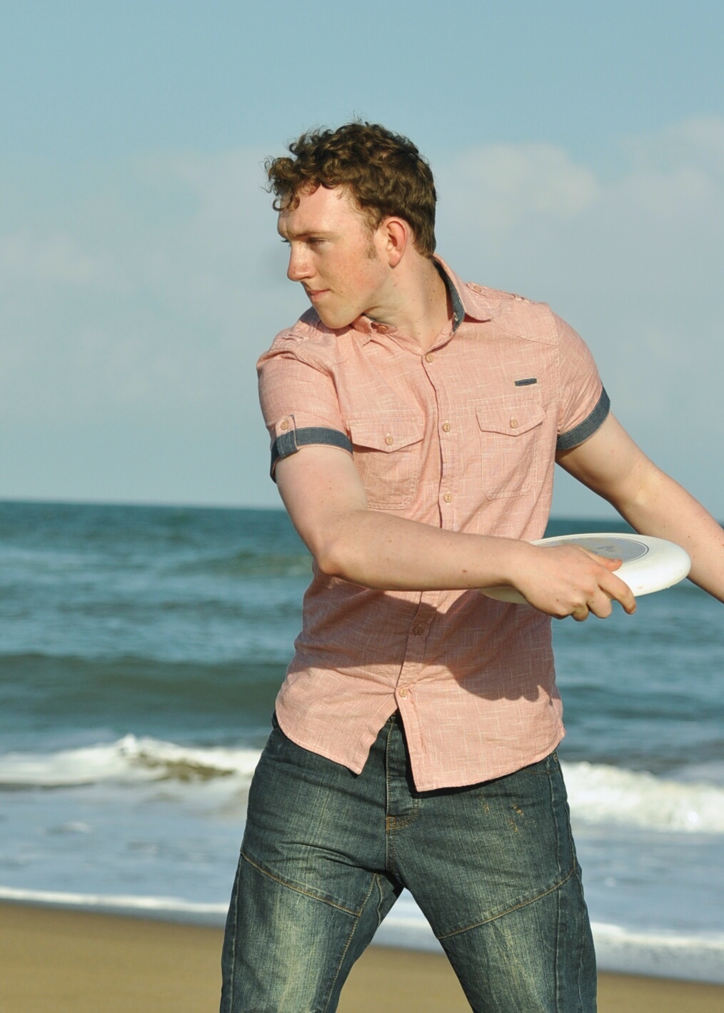 Cameron throwing a frisbee on the beach at Mtunzini, South Africa